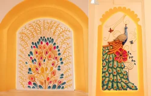 Painted peacock murals in arched niches in Dwaraka Palace